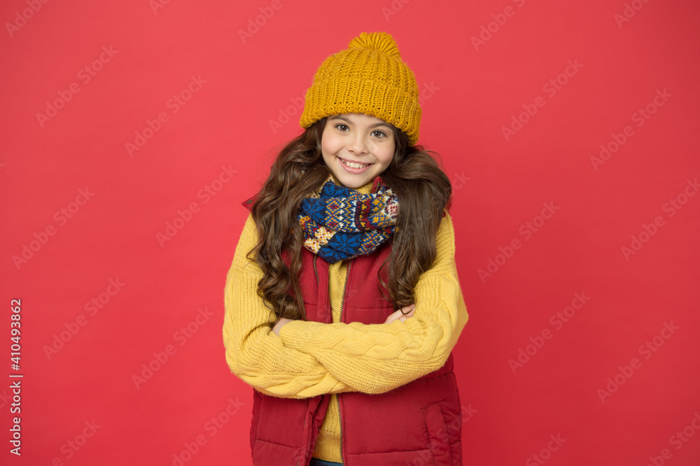 cheerful child girl with long hair and warm clothing, cozy and comfortable cheerful child girl with long hair and warm clothing, cozy and comfortable