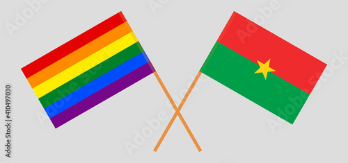 Crossed flags of LGBTQ and Burkina Faso