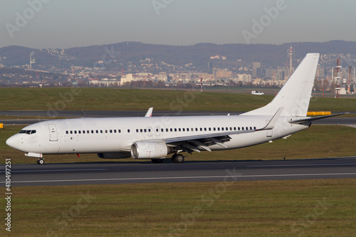 Withe Boeing 737-800 airplane on the runway