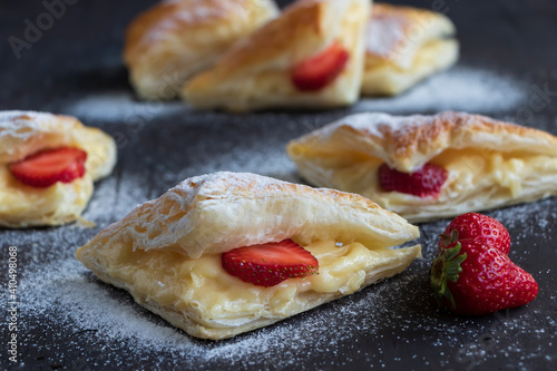 Dessert with fresh strawberry. Homemade dessert on black background.