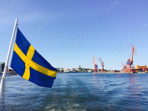 Swedish flag on boat by water
