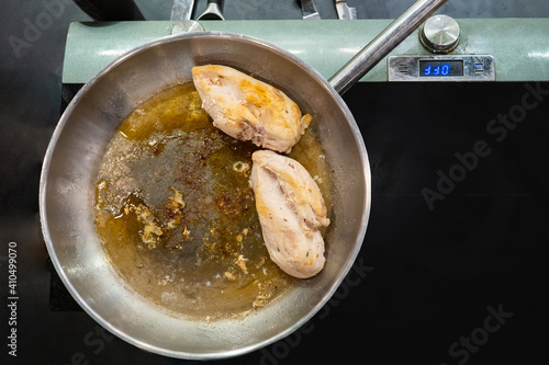 Chicken breast is fried in ...