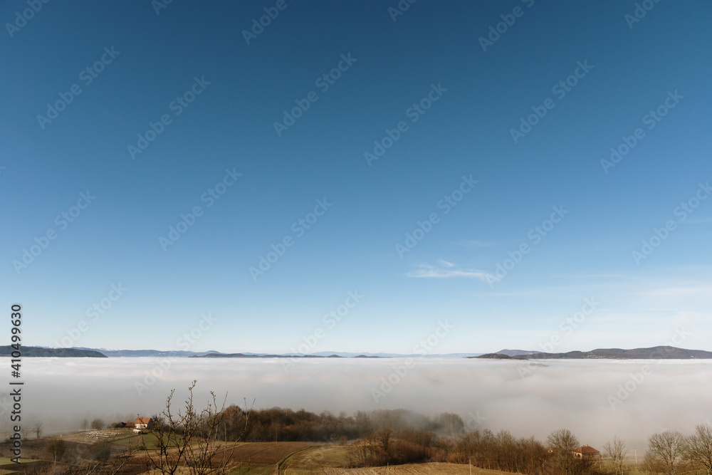 Obraz premium Dense fog over rural fields in West Serbia