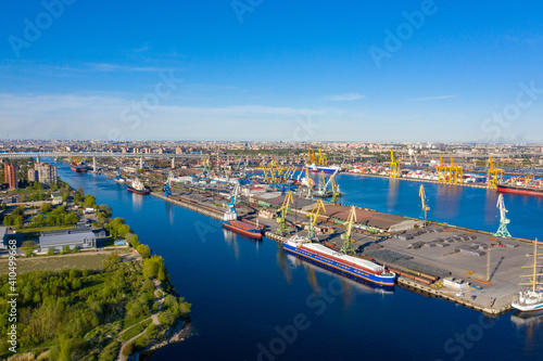 Bird's eye view of seaport. Seaport on a summer day. Freight boats off coast of sea port. Concept of cargo transportation by sea. Cargo transportation through seaport. Services for sea freight
