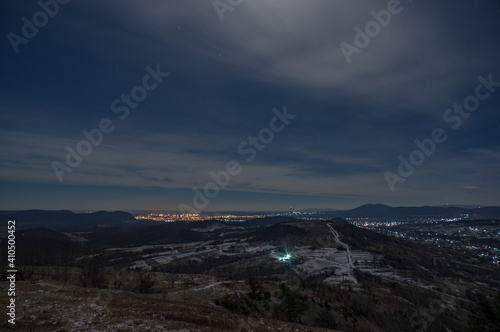 Panorama of a winter village at night in the mountains