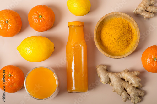 Ginger shot with citrus fruits juice, turmeric and honey.