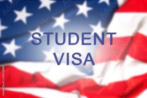 Student visa logo on USA flag background. Concept of moving to America on a student visa. Studying at one of US universities. Studying in United States. Crossing US border on a student visa.