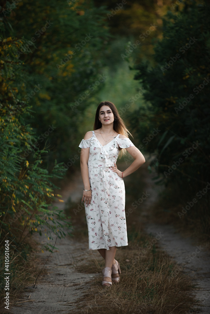 Blonde girl in summer light dress in summer outdoors Blonde girl in summer light dress in summer outdoors