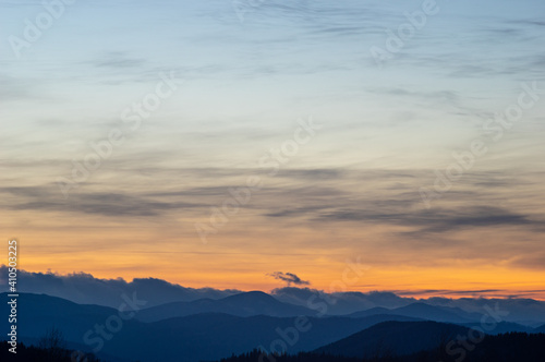 Colorful sky at sunset in the mountains © onyx124