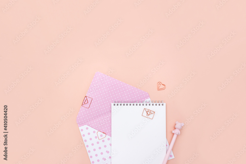 Vintage envelope, stationery and curly paper clips in the shape of heart. Concept of message for loved one. Valentine's day banner. Place for text.