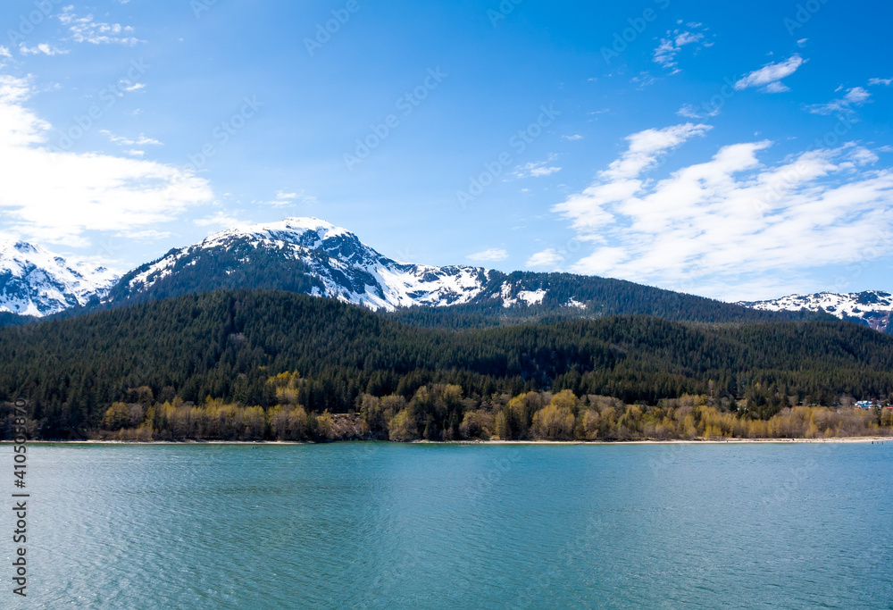 Snow-capped mountains and evergreen trees near Juneau, Alaska