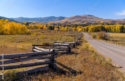 Autumn Country Road - Autumn view of colorful rolling hills and ranch land at side of Owl Creek Pass Road, Ridgway, Colorado, USA.