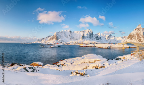 Panoramic winter view on Reine and Sakrisoya villages and bridge to Olenilsoya island.