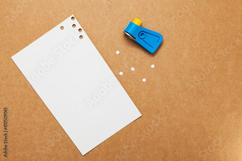 Perforated paper with a hole punch
