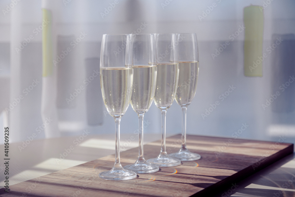 Fototapeta premium four glasses of white wine on a morning table in provence