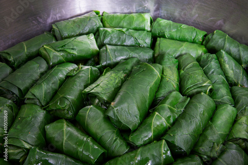 Wrap collard with rice with meat, stuffed collard in a pot is traditional Turkish cuisine.