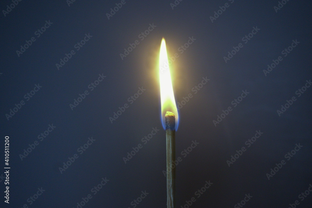 Lit Match Against Dark Background Lit Match Against Dark Background