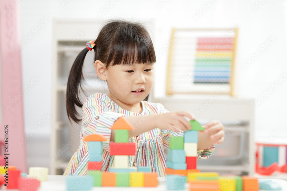 young girl playing creative toy blocks for homeschooling young girl playing creative toy blocks for homeschooling