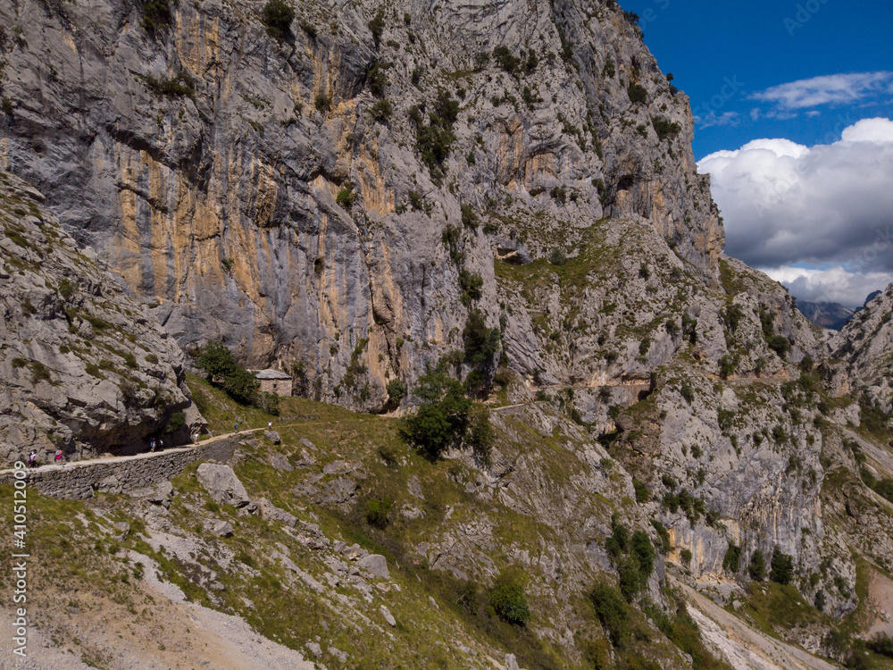 The Cares Route in the heart of Picos de Europa National Park, Cain-Poncebos, Asturias, Spain. Narrow and impressive canyon between cliffs, bridges, caves, footpaths and rocky mountains.