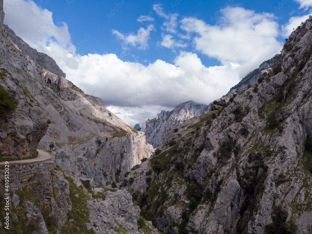 The Cares Route in the heart of Picos de Europa National Park, Cain-Poncebos, Asturias, Spain. Narrow and impressive canyon between cliffs, bridges, caves, footpaths and rocky mountains. The Cares Route in the heart of Picos de Europa National Park, Cain-Poncebos, Asturias, Spain. Narrow and impressive canyon between cliffs, bridges, caves, footpaths and rocky mountains.