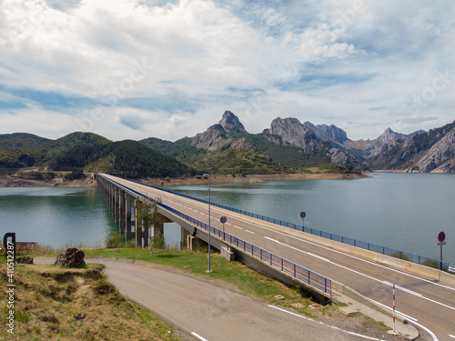 Wallpaper Mural Bridge over the Riano reservoir in Northern Spain. Yordas Peak towers over Riano, the Cantabrian Mountains, Castile-Leon region. Torontodigital.ca