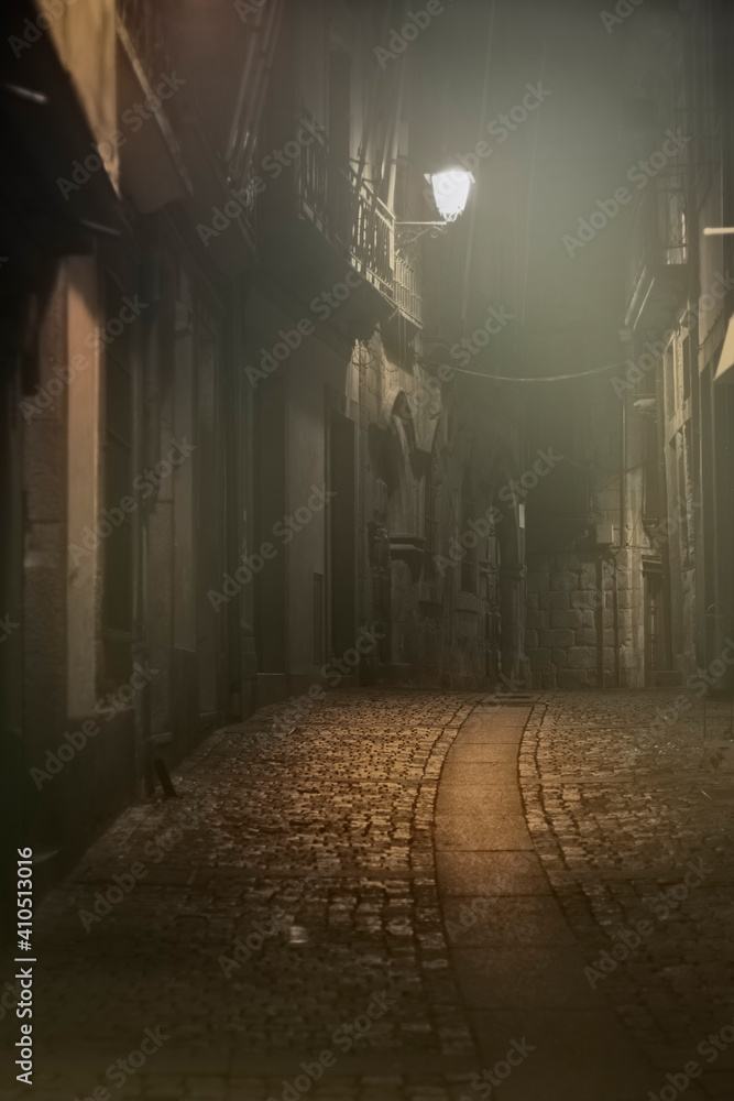 Old alley in a foggy night