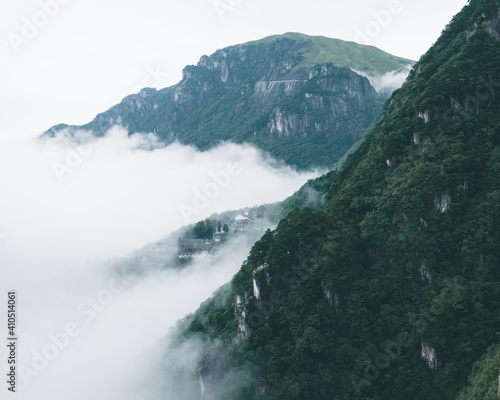 Mountain ridges and village covered in fog on Wugong Mountain in Jiangxi  China