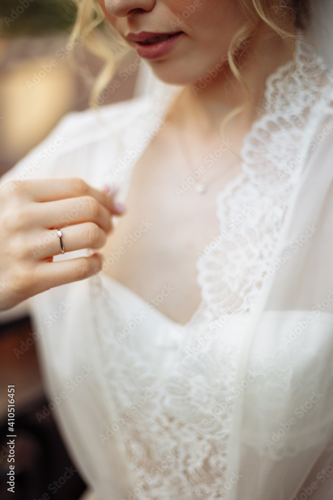 Portrait of a beautiful blond girl in image of the bride with white flowers on her head. Beauty face