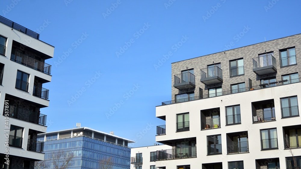 Modern apartment building in sunny day. Exterior, residential house facade. Modern apartment building in sunny day. Exterior, residential house facade.