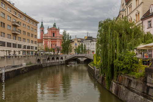 LJUBLJANA, SLOVENIA - MAY 13, 2019: Ljubljanica river and Franciscan Church of the Annunciation in Ljubljana, Slovenia