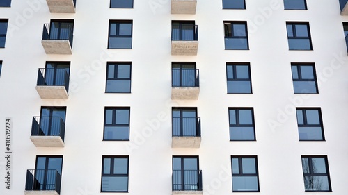 Modern apartment building in sunny day. Exterior, residential house facade.