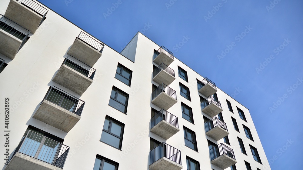 Modern apartment building in sunny day. Exterior, residential house facade. Modern apartment building in sunny day. Exterior, residential house facade.