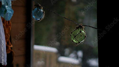 wood log house window looking at snow