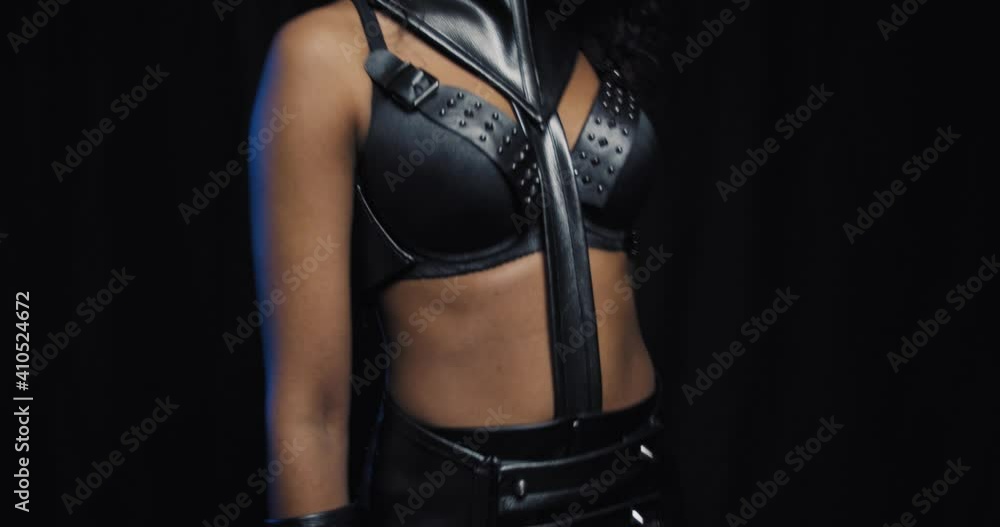 Sexy african woman in leather clothes and black mask, catwoman posing, 4k Sexy african woman in leather clothes and black mask, catwoman posing, 4k