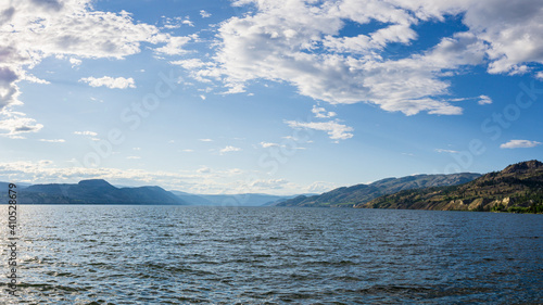 beautiful Okanagan lake with blue sky and white clouds summer day. © olegmayorov