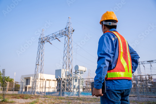 electric engineer check the transmission station.