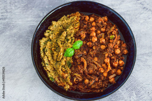 plant-based food, vegan moroccan cous cous with chickpea onion and mushroom stew with plenty of spices and herbs