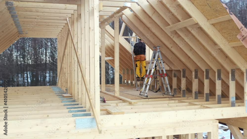 House Attic Wooden Skeleton Frame Building by Professional Construction Worker. House Attic Wooden Skeleton Frame Building by Professional Construction Worker.