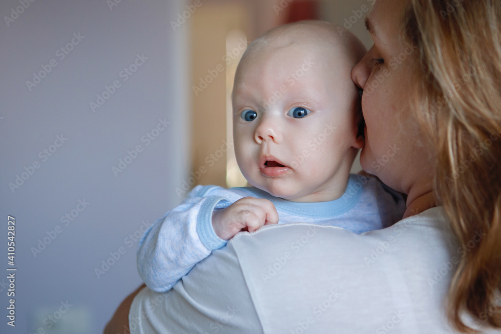 Mom holds baby boy in her arms. Mom holds baby boy in her arms.