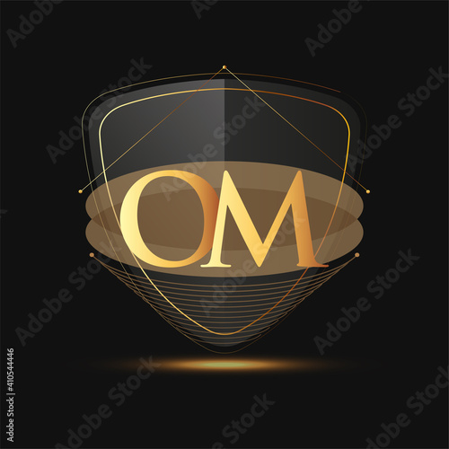 Initial logo letter OM with shield Icon golden color isolated on dark background, logotype design for company identity.