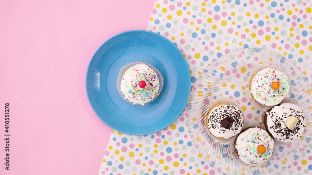 Delicious cup cakes on the plate ready for eating. Stop motion Delicious cup cakes on the plate ready for eating. Stop motion
