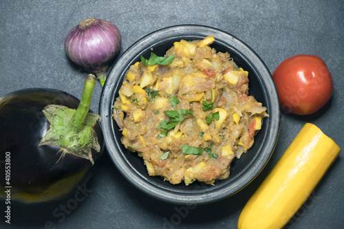 Mashed Brinjal recipe with healthy veggetable served in a Bowl.It's a popular recipe in India. photo