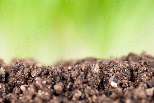 Fertile soil and green background