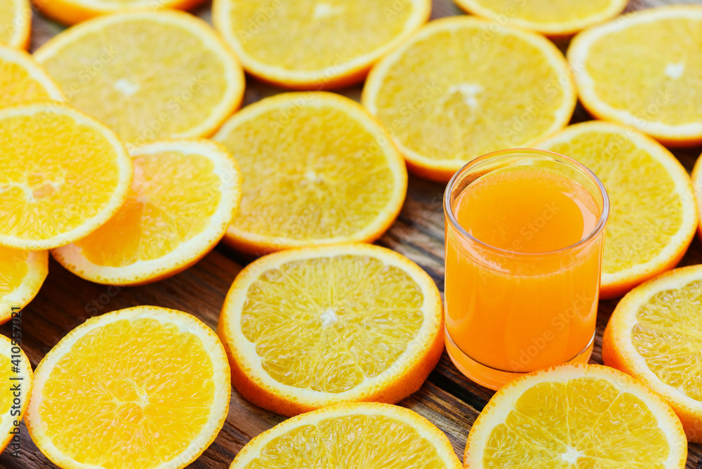 Fresh orange juice in the glass with orange fruit on wooden background, healthy fruits and orange slice. Fresh orange juice in the glass with orange fruit on wooden background, healthy fruits and orange slice.