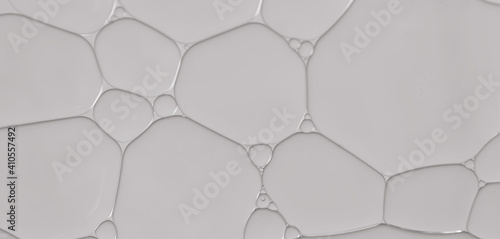 Abstract background with grey colors. Oil droplets in water abstract psychedelic pattern image.