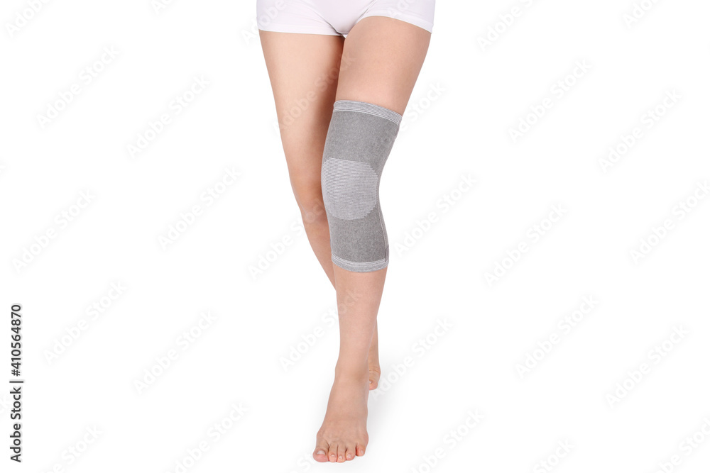 Knee Support Brace on leg isolated on white background. Orthopedic Anatomic Orthosis. Braces for knee fixation, injuries and pain. Orthotics. Foot orthosis. Knee Joint Bandage Sleeve. Elastic Sports Knee Support Brace on leg isolated on white background. Orthopedic Anatomic Orthosis. Braces for knee fixation, injuries and pain. Orthotics. Foot orthosis. Knee Joint Bandage Sleeve. Elastic Sports