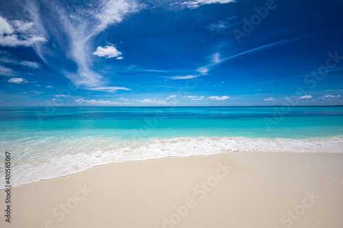 Fototapeta Naklejka Na Ścianę i Meble -  Closeup of sand on beach and blue summer sky. Panoramic beach landscape. Empty tropical beach and seascape. Blue sky, soft sand, calmness, tranquil relaxing sunlight, summer mood. Travel vacation