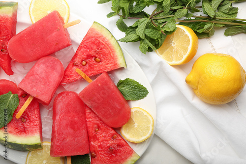 Composition with watermelon ice cream on light background