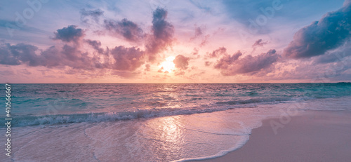 Fototapeta Naklejka Na Ścianę i Meble -  Closeup sea sand beach. Panoramic beach landscape. Inspire tropical beach seascape horizon. Orange and golden sunset sky calmness tranquil relaxing sunlight summer mood. Vacation travel holiday banner