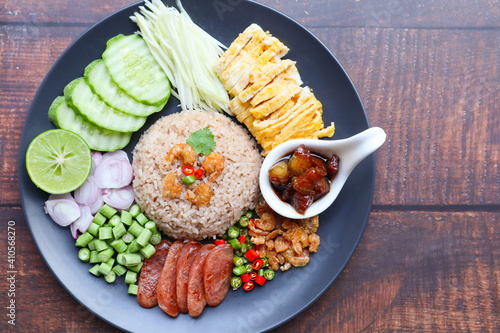 Shrimp paste rice on wood background with copy space - Thai Food called Khao Klook Kapi